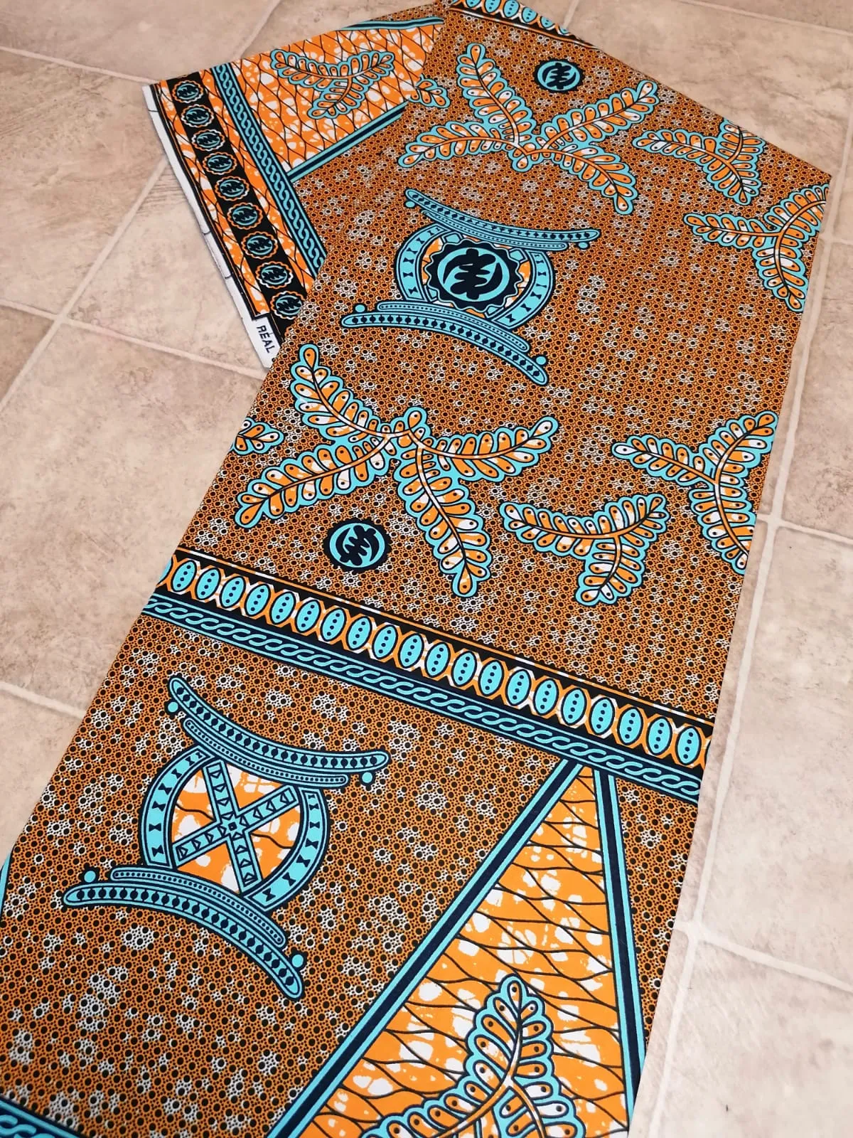 Africká látka měkčí, modro oranžová